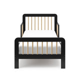 Front view of a black toddler bed with driftwood finish