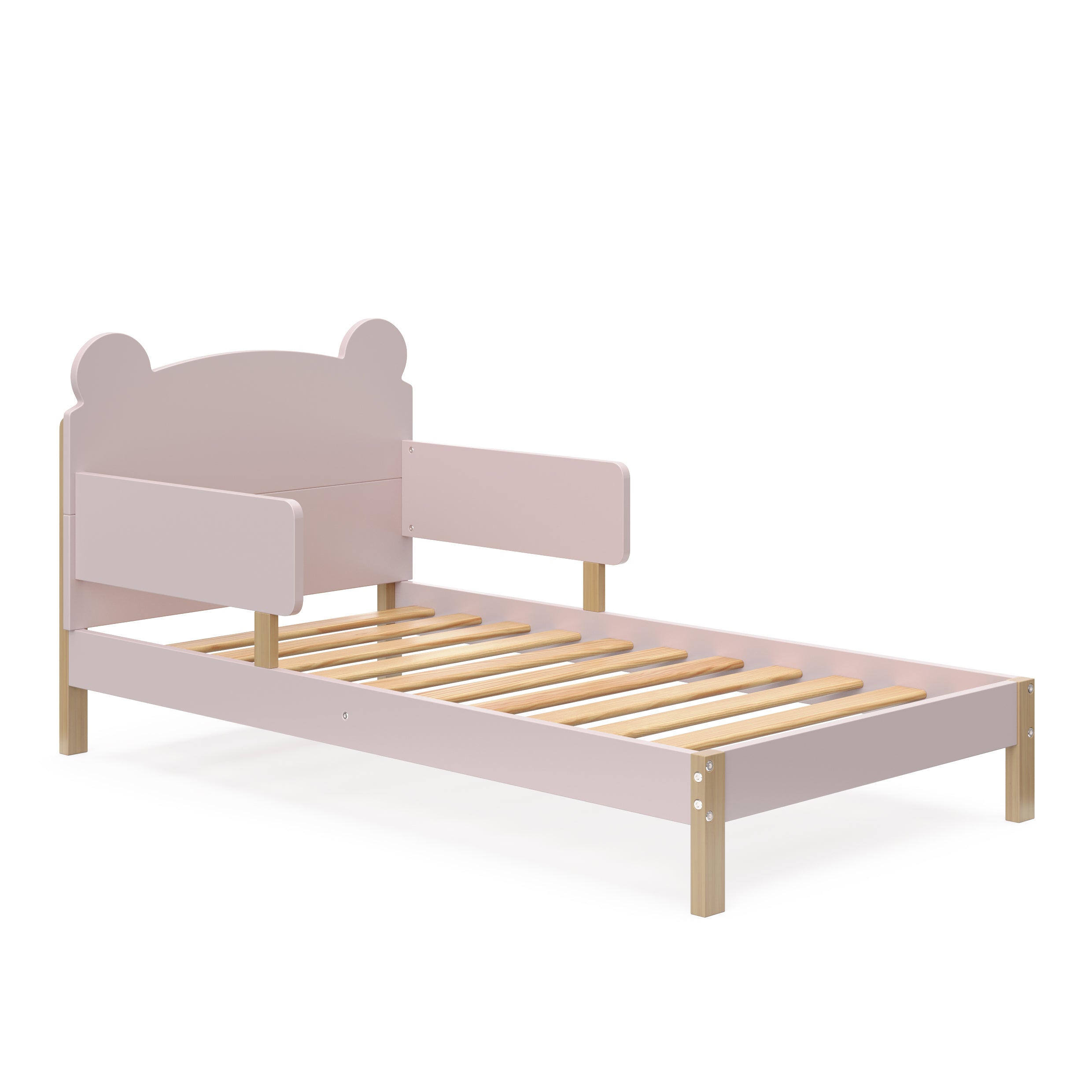 Angled view of a blush-colored toddler bed