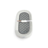 front view of an oval changing pad with a textured cover and liner