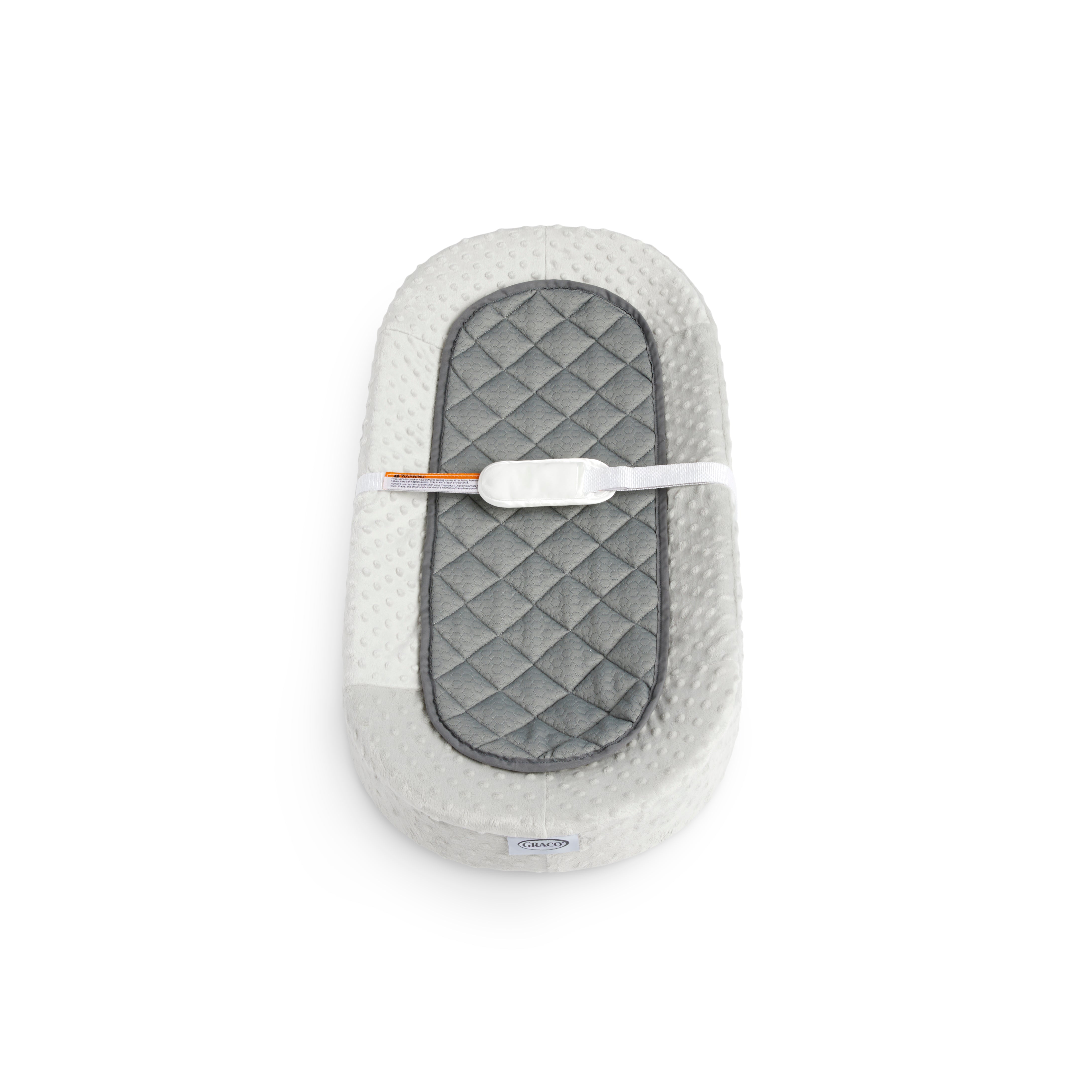 Graco® Oval Contoured Changing Pad with Bonus Cover and Water-Resistant Liner.