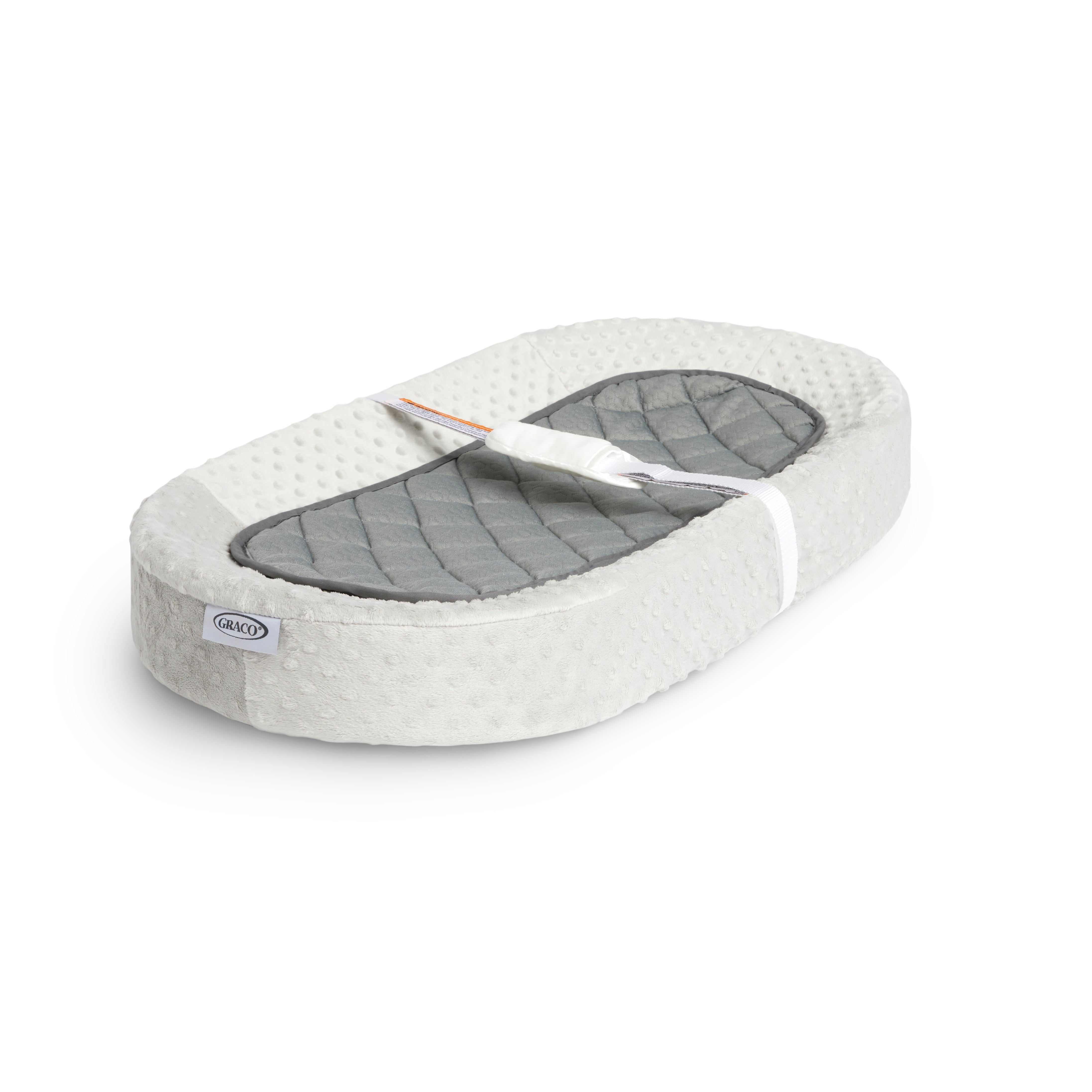 Graco® Oval Contoured Changing Pad with Bonus Cover and Water-Resistant Liner.