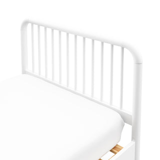 close up view of white twin bed 