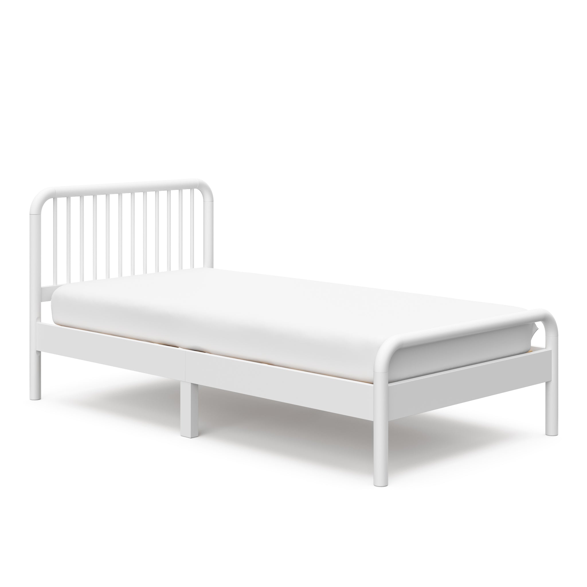 angled view of white twin bed 