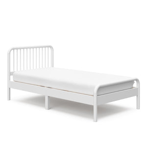 angled view of white twin bed 