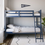  navy bunk bed with fixed ladder angled with bedding in a nursery